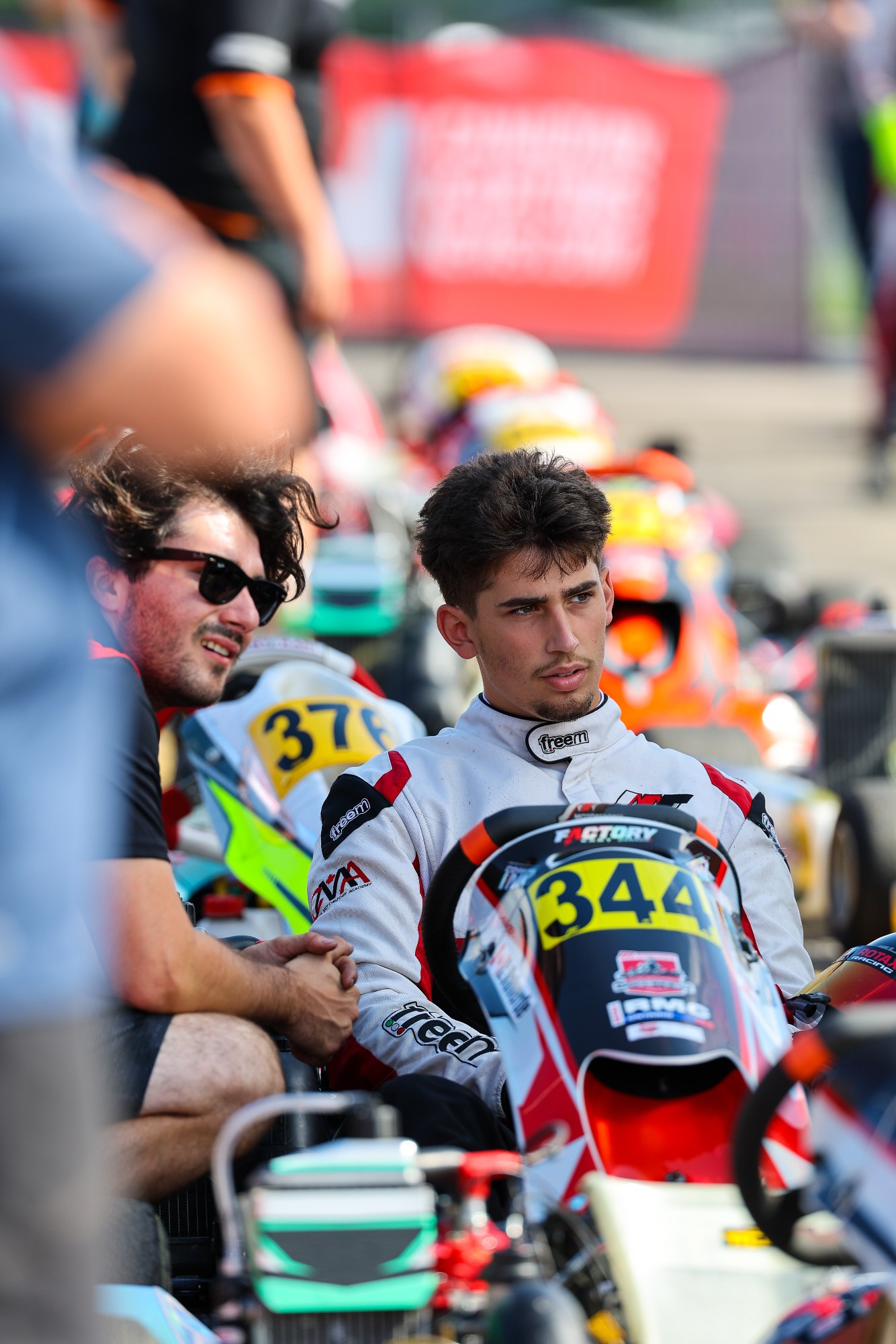 Christian Valverde in the paddock beside kart 344
