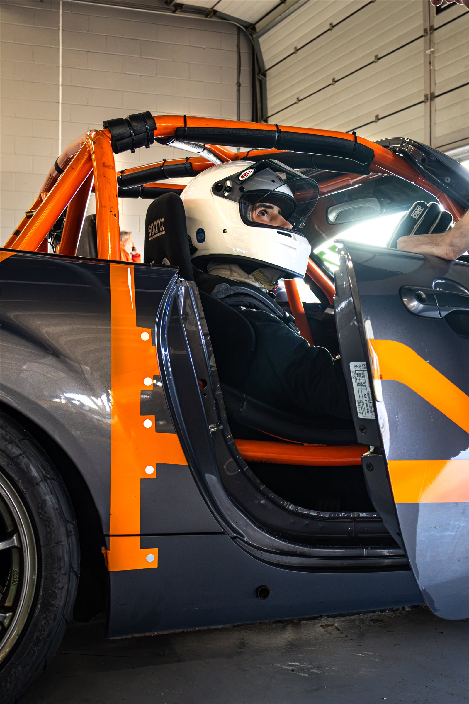 Christian Valverde in the cockpit of the MX-5 with the door open