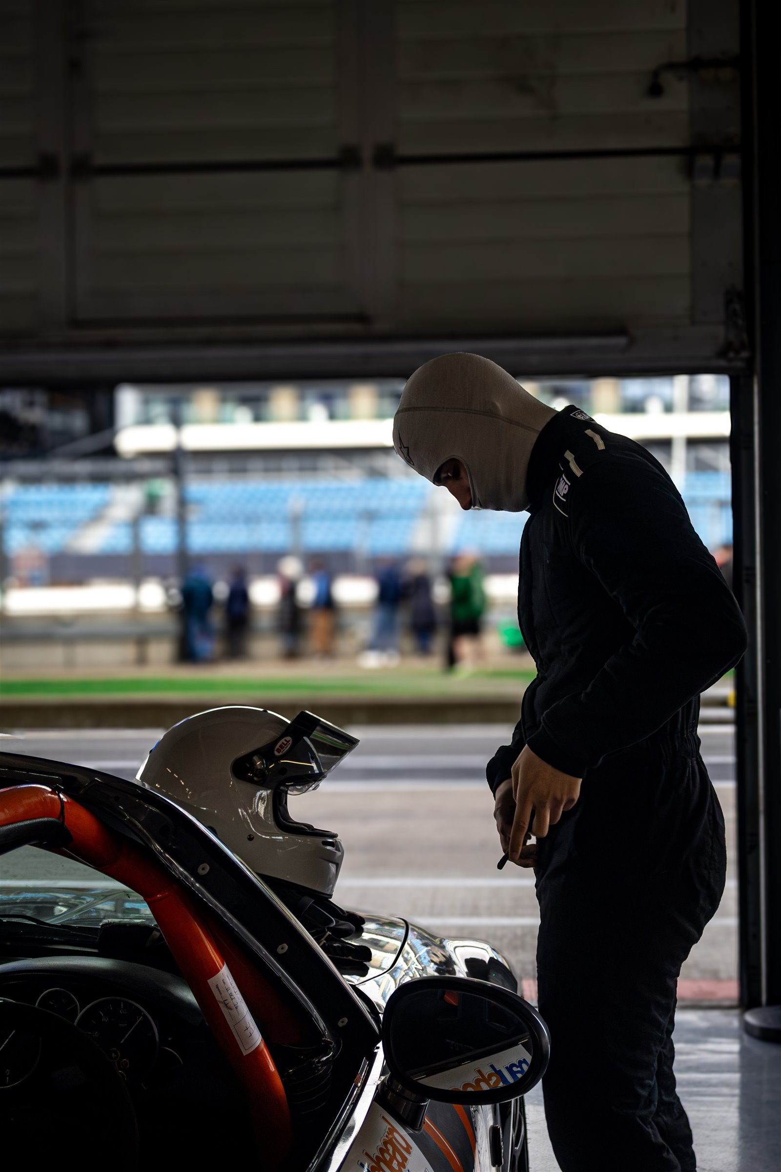 Christian Valverde beside the MX-5 at the garage door